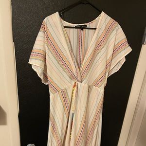 High low Shiite with Pom accents